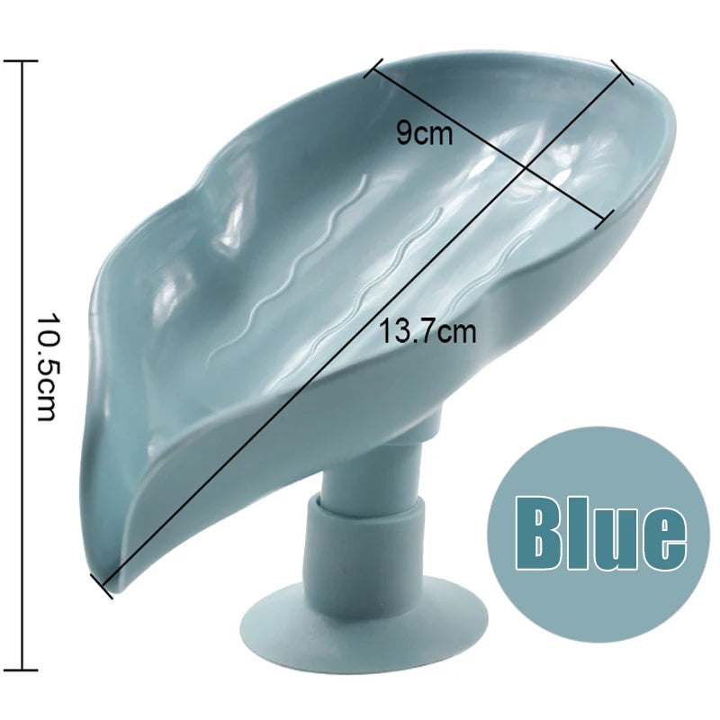 A light blue leaf-shaped suction cup soap dish with measurements and a base.