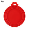A red silicone reusable food storage lid with a handle.