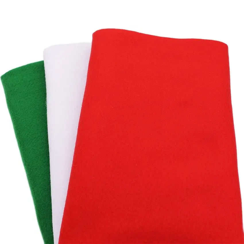 Three vertical strips of red, white, and green soft felt fabric for crafting