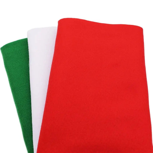 Three vertical strips of soft felt fabric in red, white, and green for sewing projects