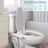 A white ceramic toilet with a mounted Samodra bidet attachment and surrounding bathroom fixtures.