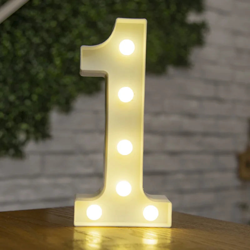 A glowing white LED light shaped like the number one, displayed on a wooden surface.