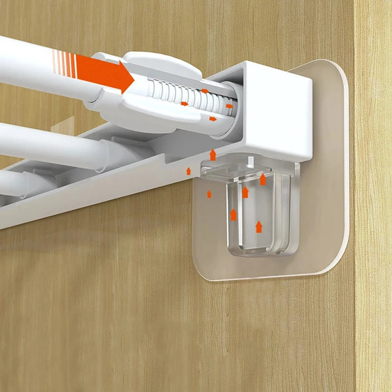 White adhesive shelf support pegs being inserted into a cabinet or closet shelf.