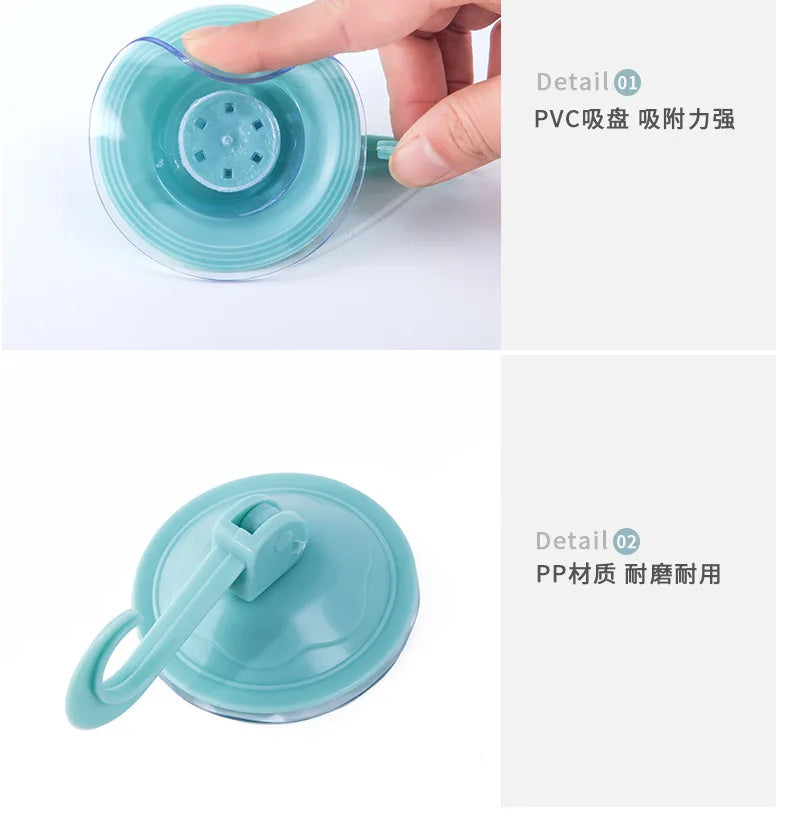 A hand is holding a clear blue suction cup hook, demonstrating its grip and detail.