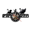 A black vinyl record wall clock featuring stylized animal figures and a clock face.