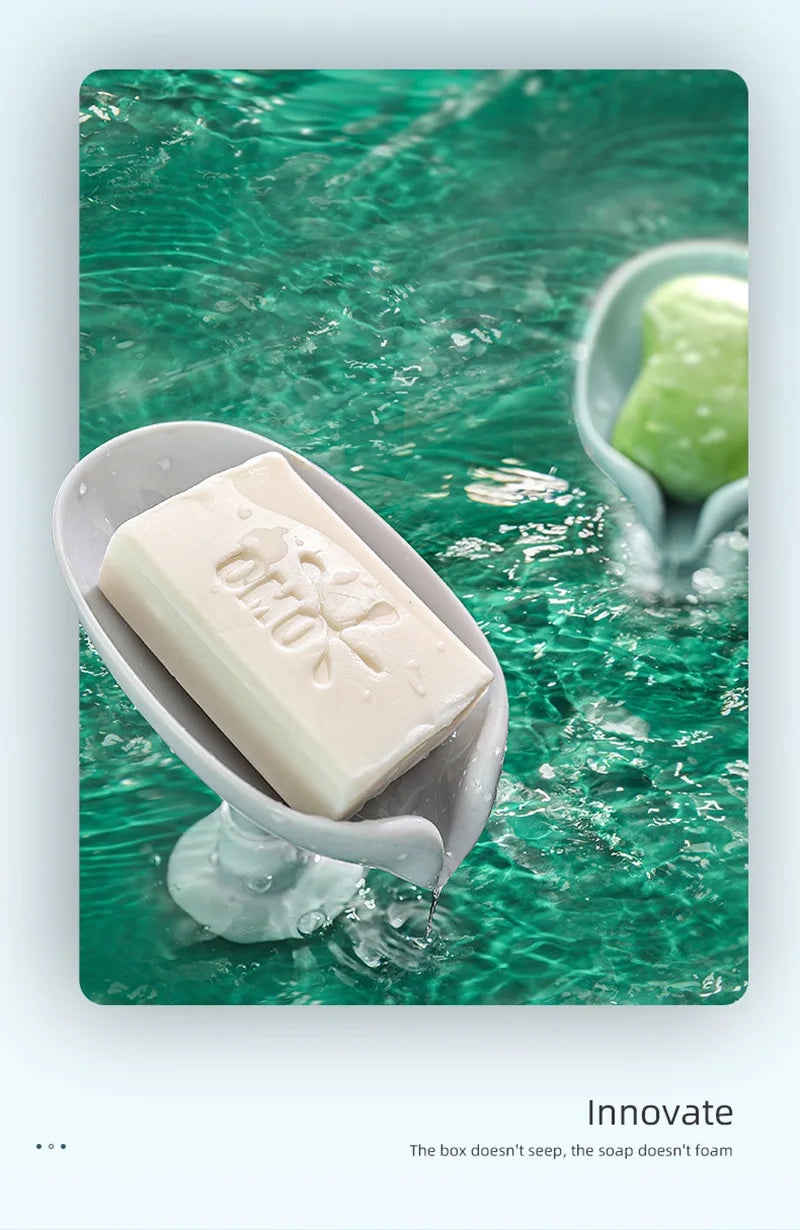 A bar of white soap is dripping into clear water, resting in a light gray dish amidst green, textured water.