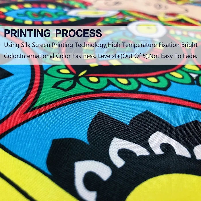 A close-up of a colorful fabric print featuring a chicken design and decorative patterns.