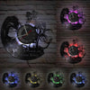 A collection of vinyl record wall clocks featuring a lion king theme and various colored lighting.