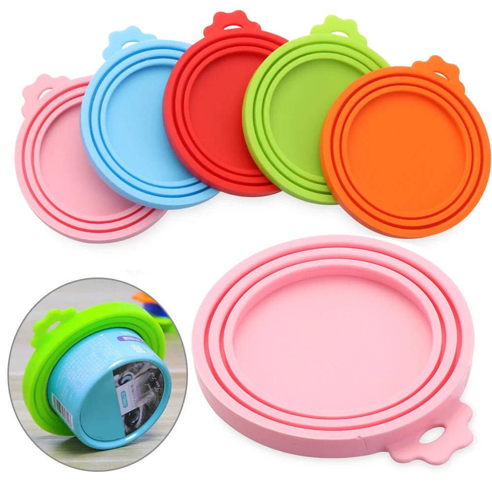 A collection of colorful silicone reusable food storage lids and covers in pink, blue, green, and orange.
