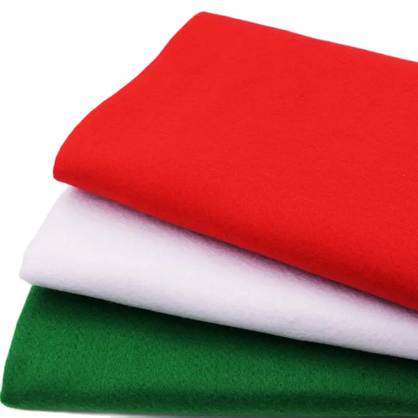 A stack of three felt fabric pieces in red, white, and green.