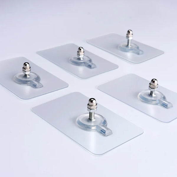 Several clear self-adhesive wall hooks with silver mounting posts are displayed on a white background.