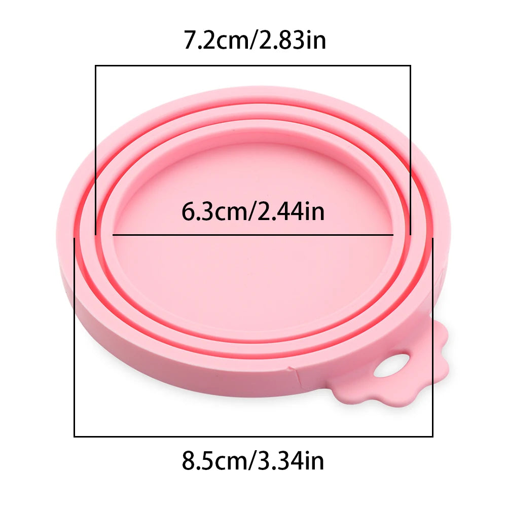 Pink silicone reusable food storage lid with a round base and a small handle.