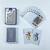 A set of playing cards including a full deck, a stack of cards, and a joker card displayed on a white surface.