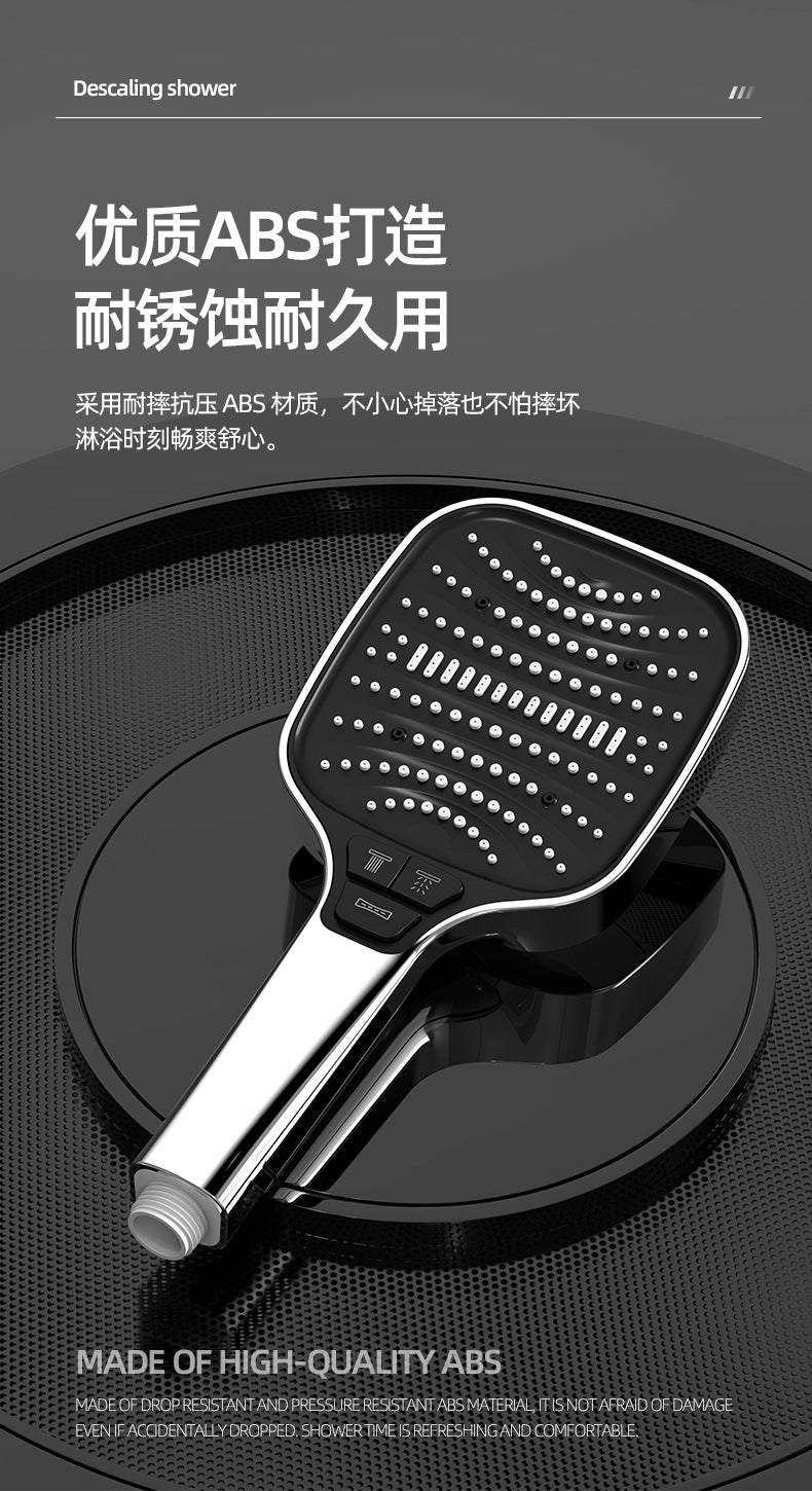 A silver high-pressure ABS handheld shower head is shown resting on a black surface.