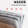 A close-up view of a gray, fibrous cleaning brush being used to clean grooves or gaps.