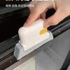 A hand is using a white cleaning brush to quickly remove dirt from a window gap.
