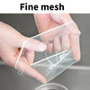 A hand is holding a fine mesh strainer bag, demonstrating its delicate texture and use.