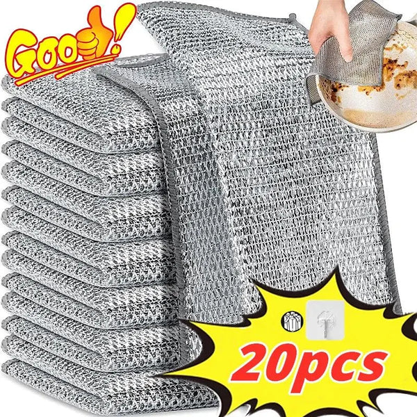 A stack of gray thickened metal wire cleaning cloths with one cloth being held above them.