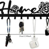Black rustic metal wall hook key holder with decorative floral cutouts and hanging keys