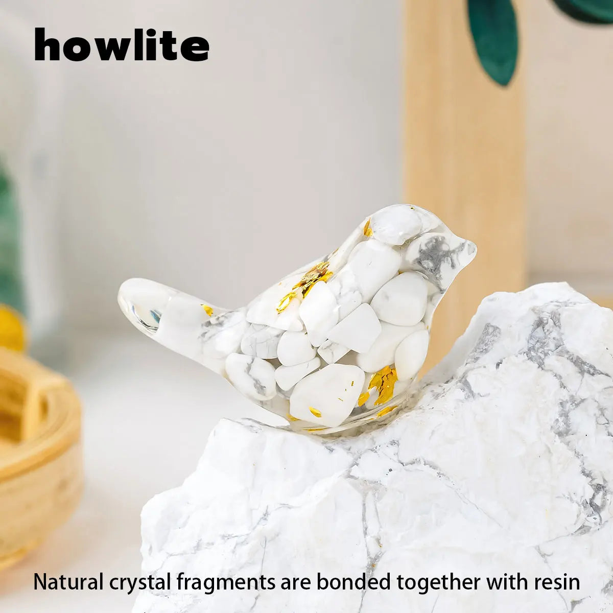 A white crystal bird statue made of natural crystal fragments bonded with resin resting on a white marble surface.
