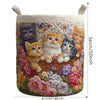 A quilted floral laundry basket with handles, featuring various small cats in a colorful fabric design.