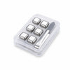 A clear plastic container holding six reusable stainless steel whiskey ice cubes and a silver knife.