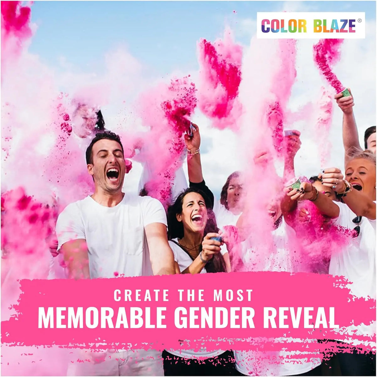 A group of people celebrating with vibrant pink color powder during a gender reveal event.