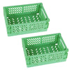 Two green foldable plastic storage baskets with perforated bottoms and handles.