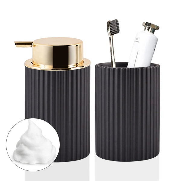 A black corrugated dispenser holds a white foaming soap and a brush toothbrush holder.