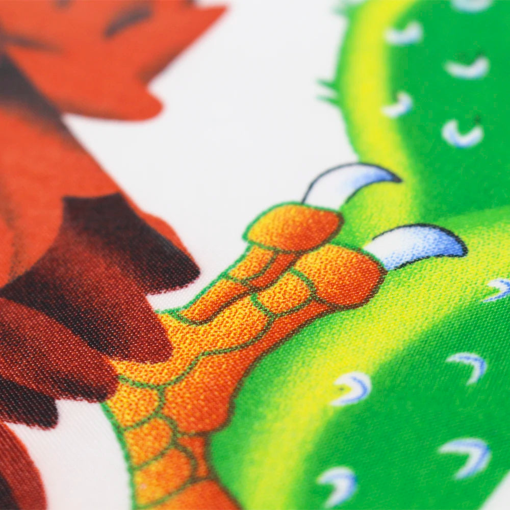 Close-up of a large outdoor flag decoration featuring an orange and green cactus design.
