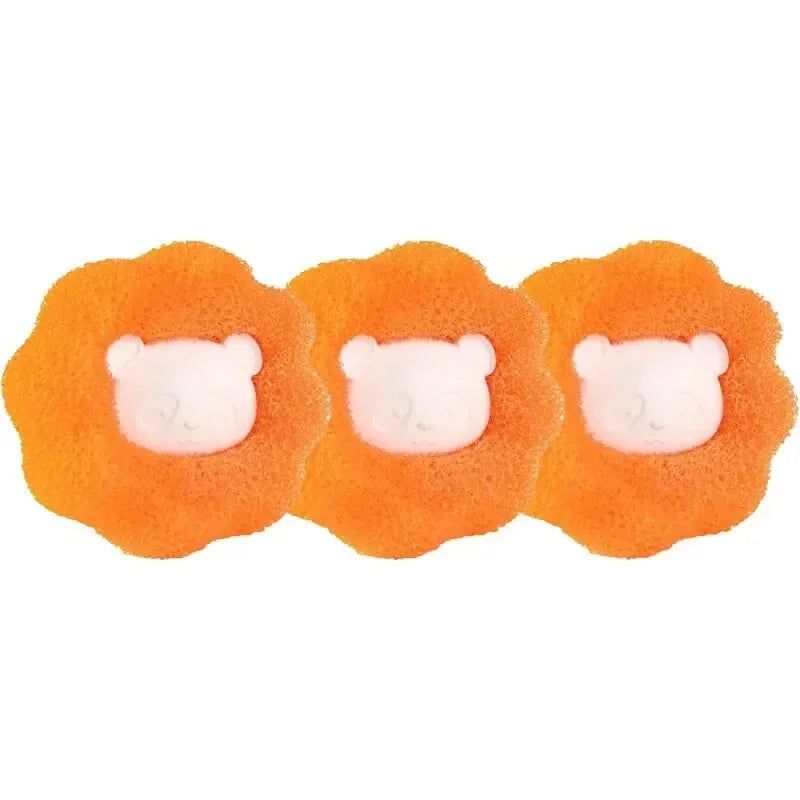 Three orange reusable pet hair and lint remover balls with white heads