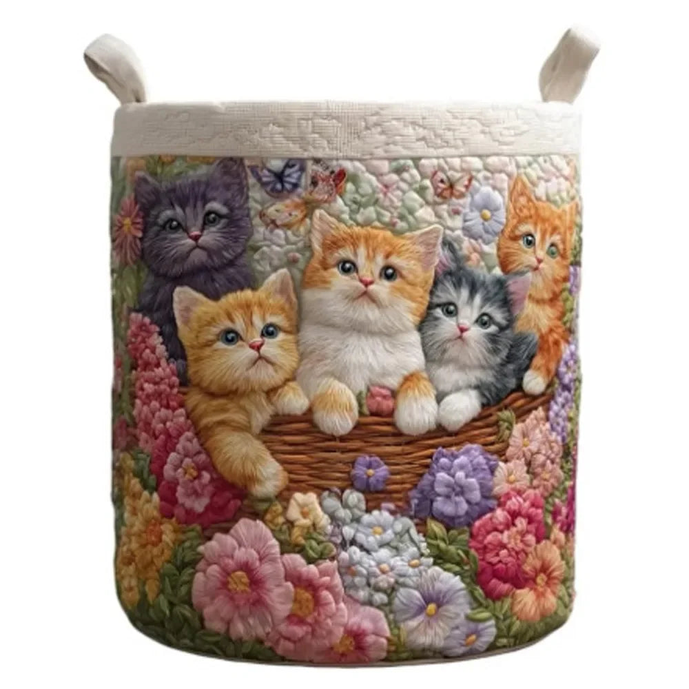 A quilted floral storage basket for laundry with handles, featuring soft pastel colors and fabric flowers.