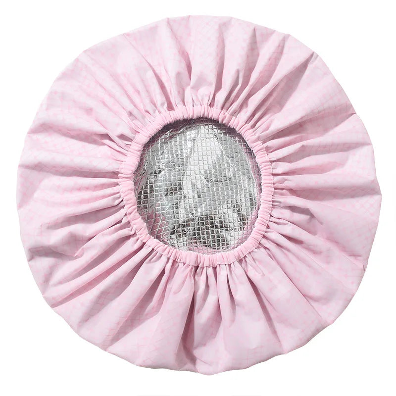 Pink self-heating tin foil hair mask cap with a circular mesh opening
