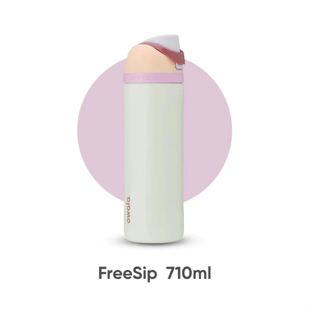 A white insulated water bottle with a pink lid and straw, labeled FreeSip 710ml.