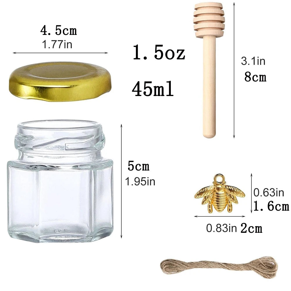 A set of mini glass honey jars with wooden dippers and a gold lid, packaged with a twine.