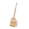 A beige toddler mini broom and dustpan set with a handle and brush.