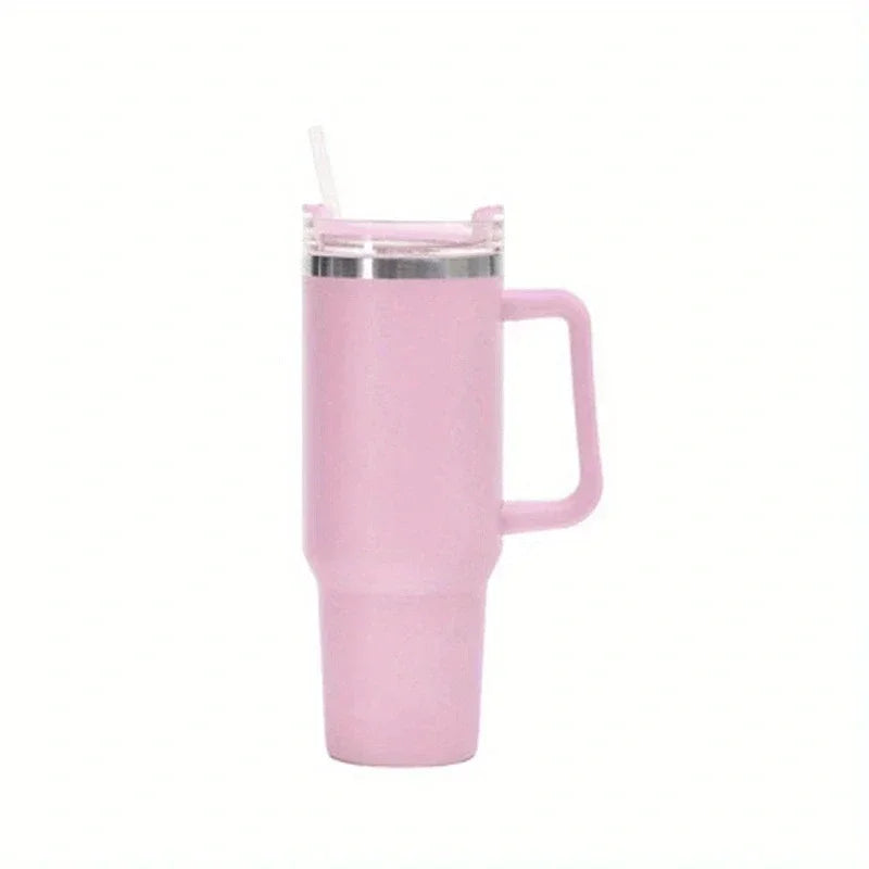 A pink insulated stainless steel tumbler with a handle and straw.