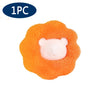 One reusable lint and hair remover ball with an orange textured outer layer and a white bear face center.