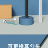 A black visual ear cleaning tool with a blue tip and a white handle is shown next to its packaging.