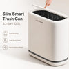 A white slim smart trash can is shown with its lid open, highlighting features like auto bagging and a narrow space design.