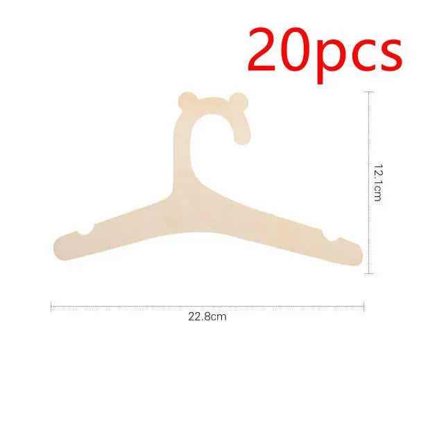 A light wooden clothing hanger shaped like a stylized animal for kids and apparel.
