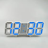 A digital alarm clock display showing 08:00 with blue LED numbers and a gray face.
