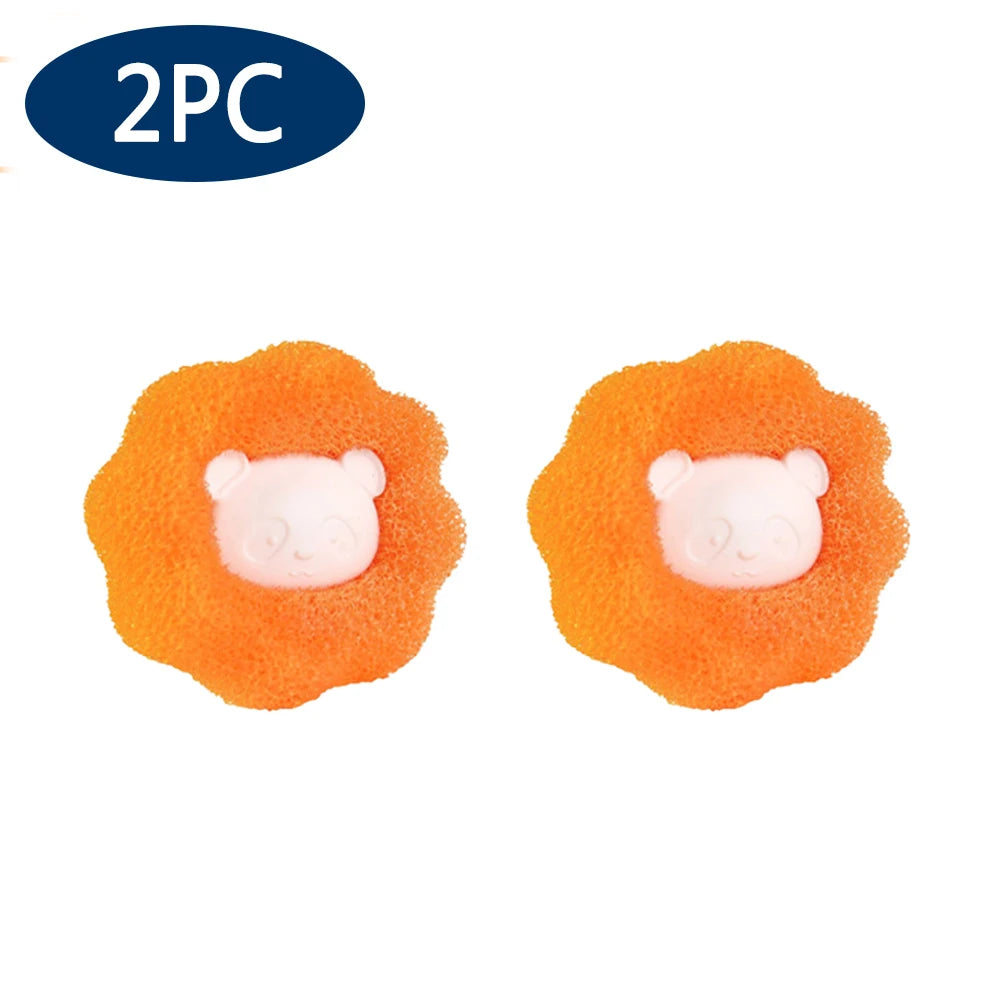 Two orange reusable lint and hair remover balls with white bear faces