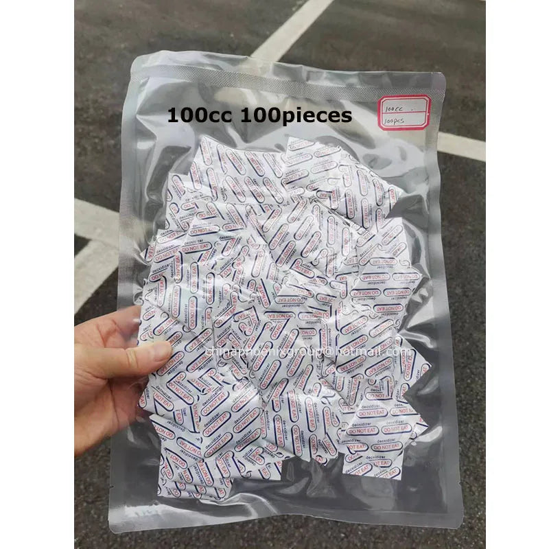 A clear plastic bag filled with 100 pieces of food-grade oxygen absorbers for extended dry food storage.