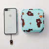 A light blue floral nylon sanitary pad storage pouch next to an iPhone.