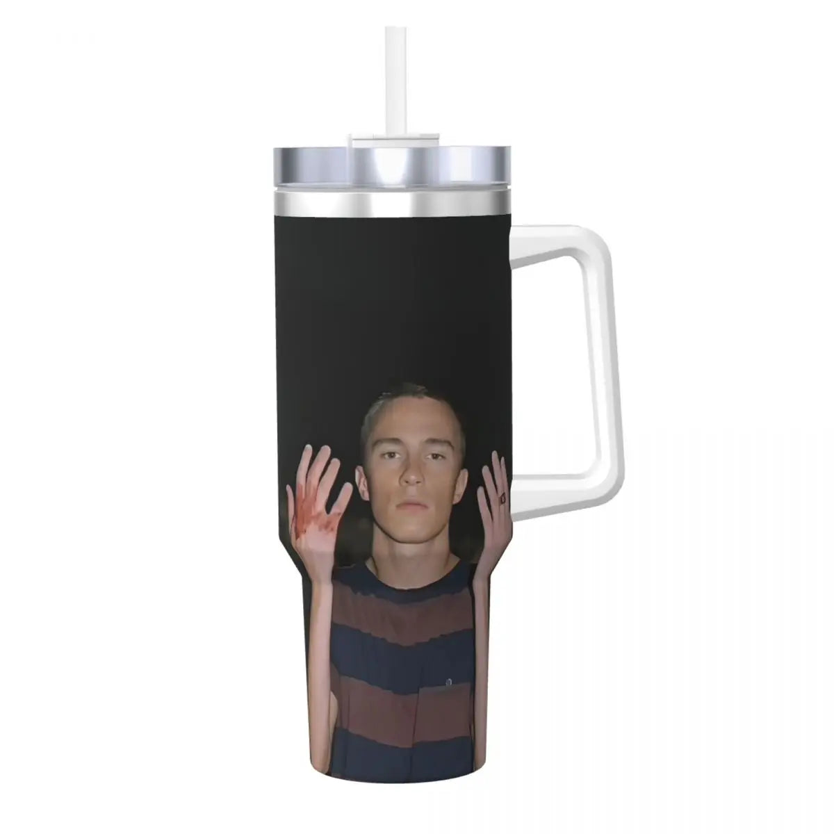 A black stainless steel travel tumbler mug with a silver lid and a person's face visible through the material.