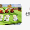 A collection of resin highland cow figurines in various colors and poses displayed on green grass.