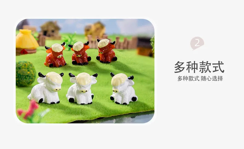A collection of resin highland cow figurines in various colors and poses displayed on green grass.