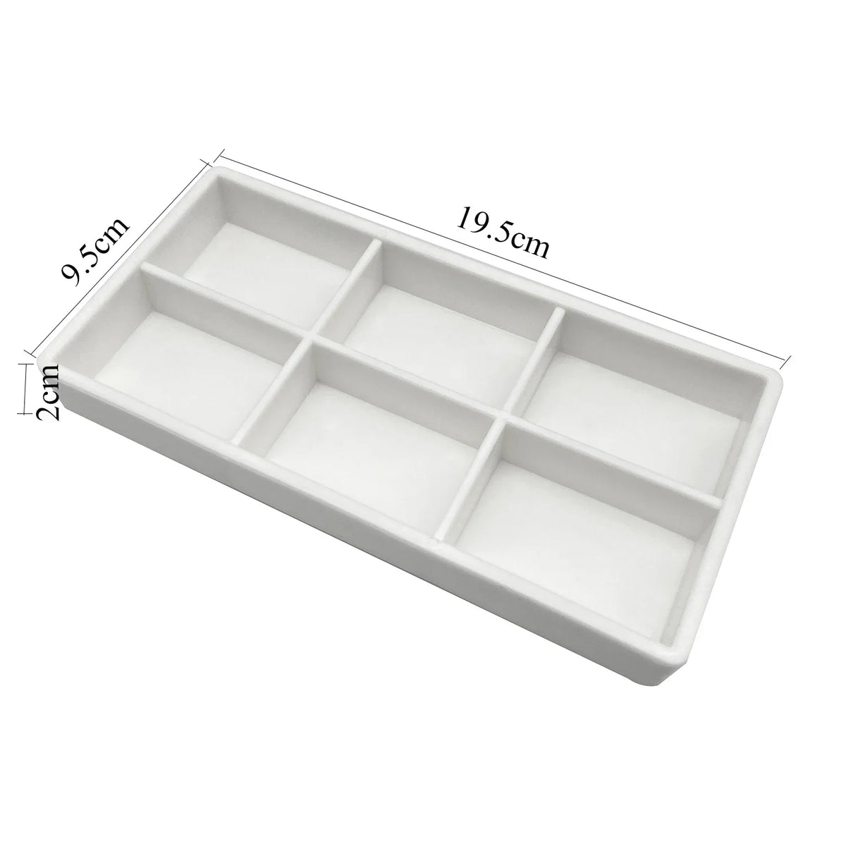 White dental autoclavable cabinet tray organizer with a rectangular shape and divided compartments.