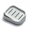 A white double layer drain soap dish with three slots for soap